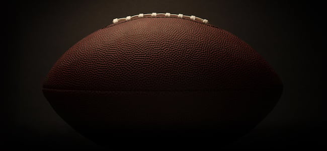 American football on dark background