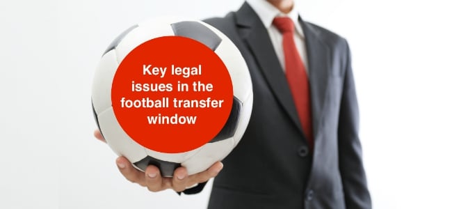 Businessman_holding_a_soccer_ball_on_white_background_key_legal_issues