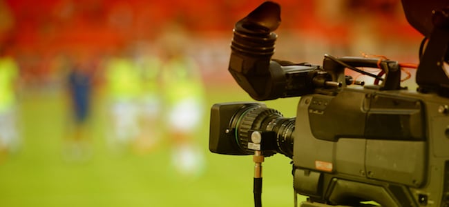Camera filming on sports field