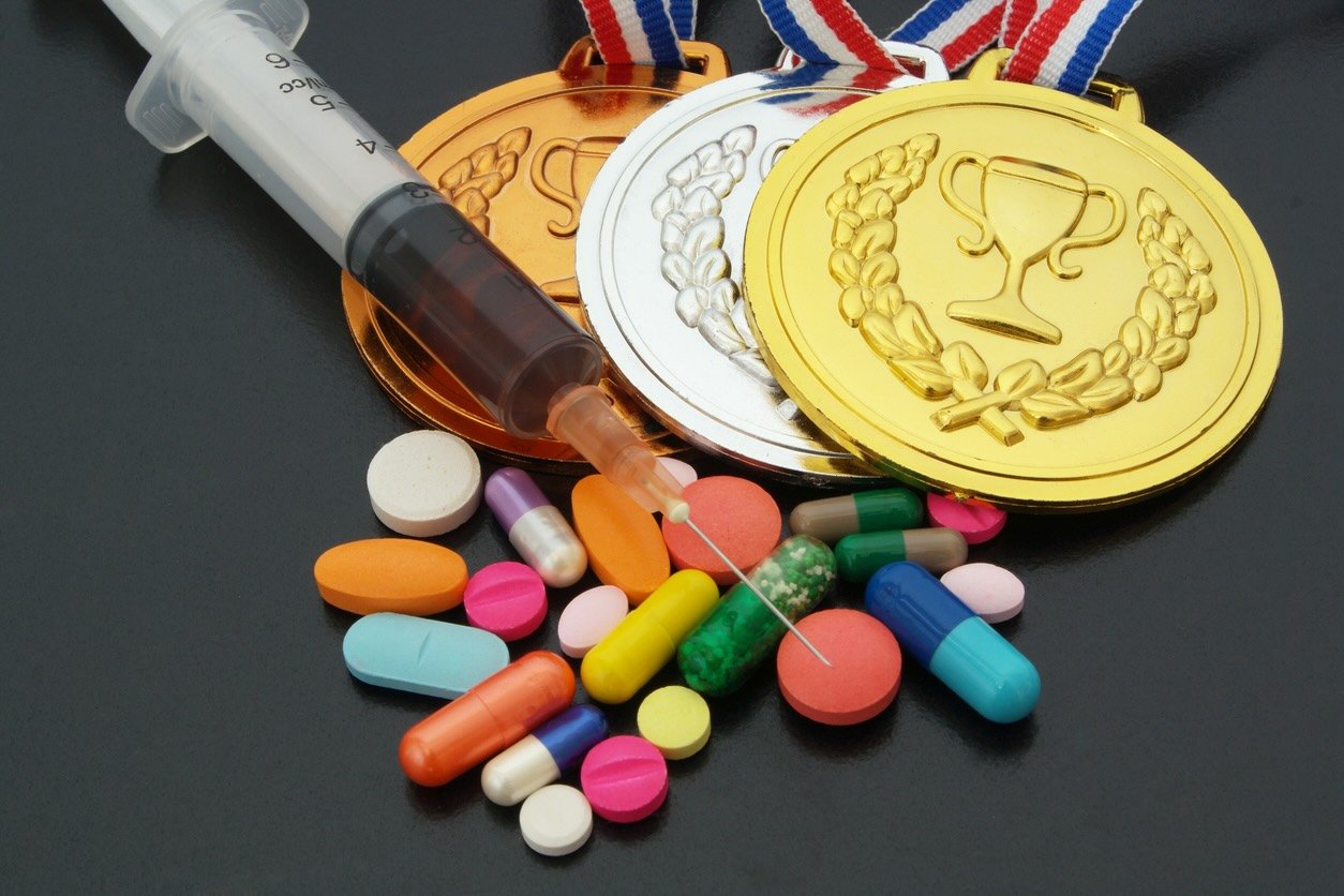 Doping in sport concept drugs medals and syringe