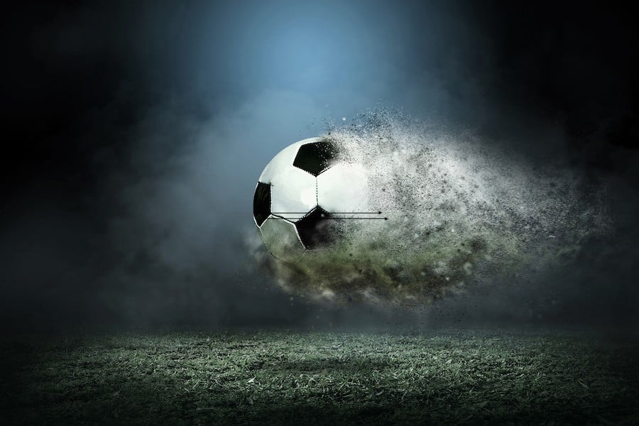 Ball dissolving in air over a football pitch Ball dissolving in air over a football pitch