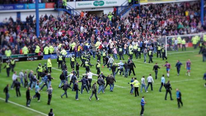 Football fans invading pitch