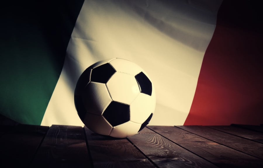 Football in front of the Italy flag Football in front of the Italy flag