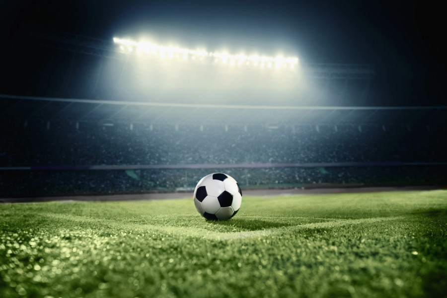 Title image of soccer ball on athletic field in stadium arena