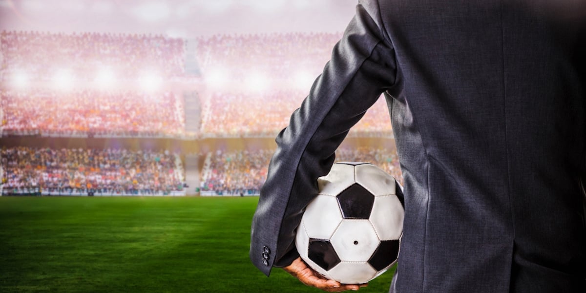 Football manager on field