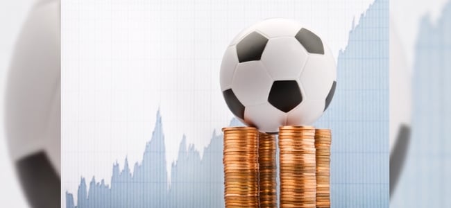 Football on stack of coins