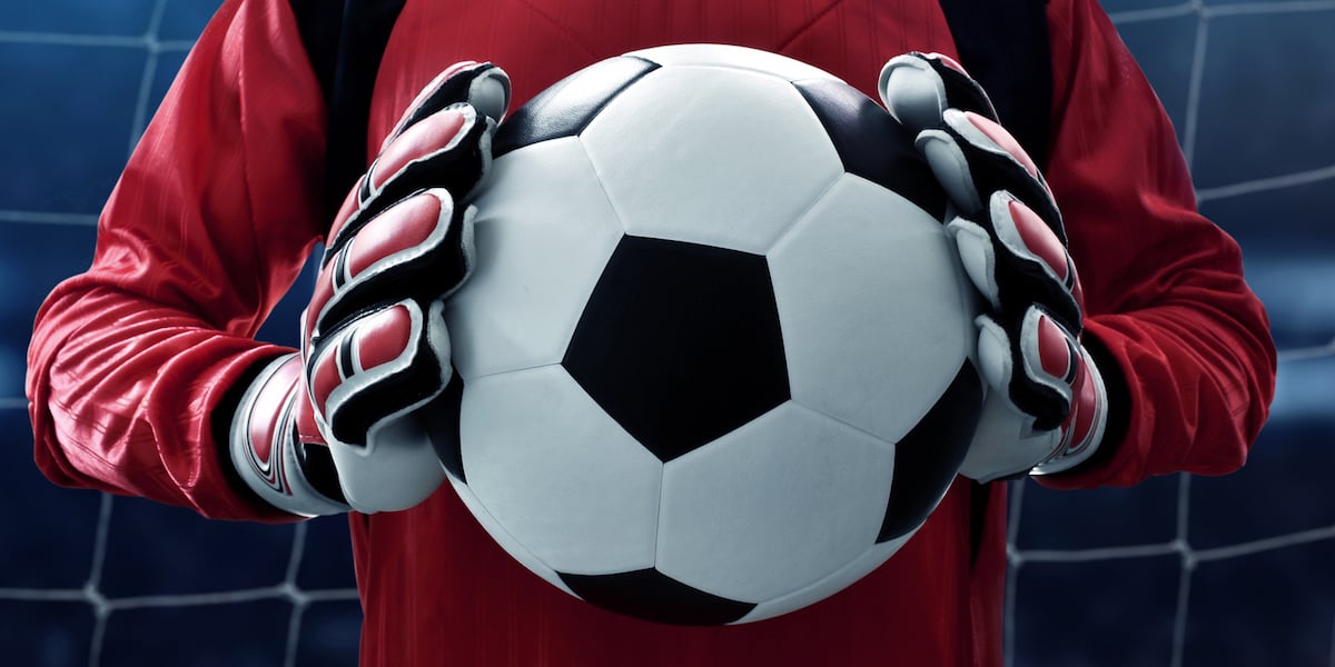 Goalkeeper holding football