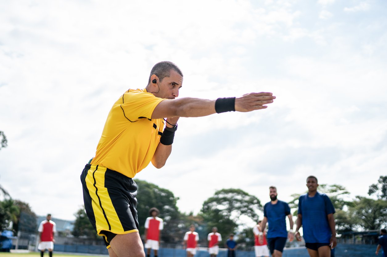 Football referee whistling