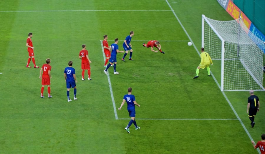 Footballer Heading Ball In Goal Footballer Heading Ball In Goal