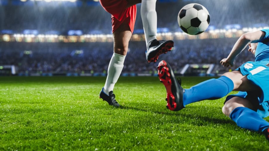Footballer Tackling Footballer Tackling