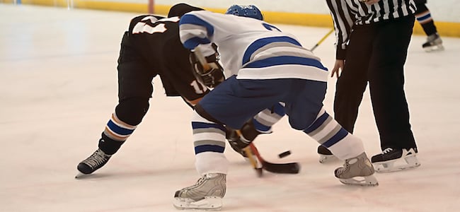 Ice hockey players facing off