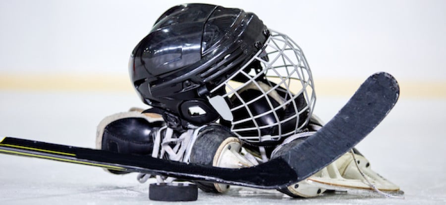 Ice hockey gear on the ice inside rink