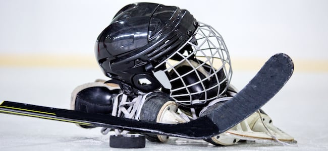 Ice hockey gear on the ice in rink