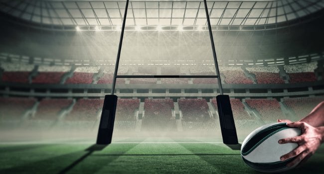 Rugby_Player_Holding_Ball_in_Front_of_Goal