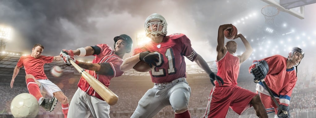 Action photo of baseball, basketball and American football player