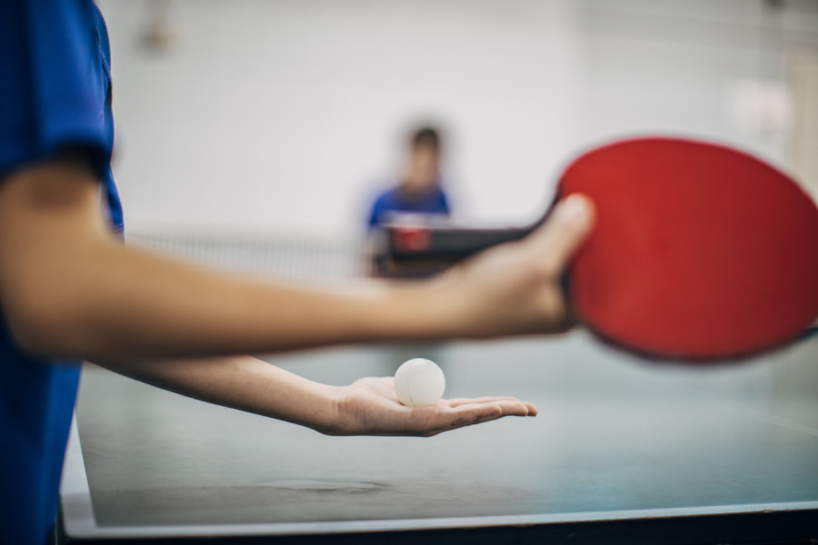 Table Tennis Player Holding Ball