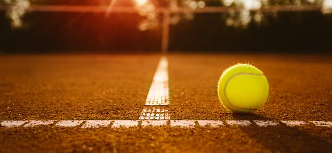 Tennis ball on clay court