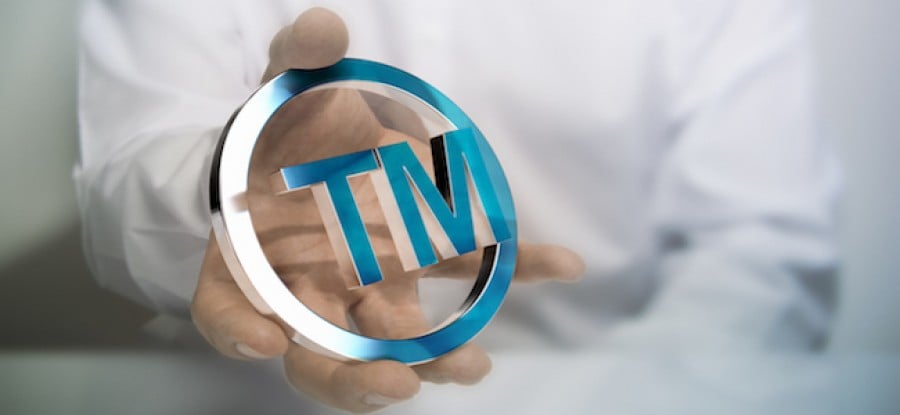 Man holding trademark symbol