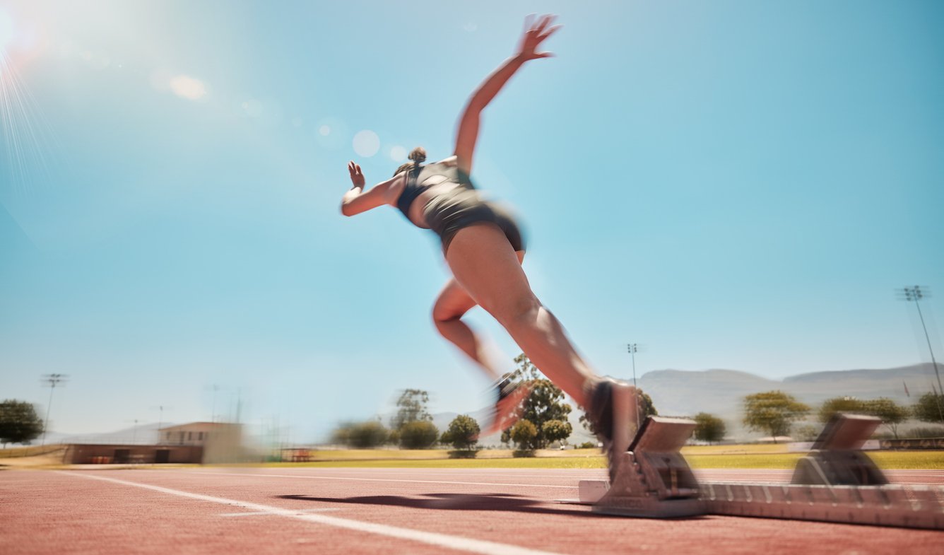 Woman Running On Track