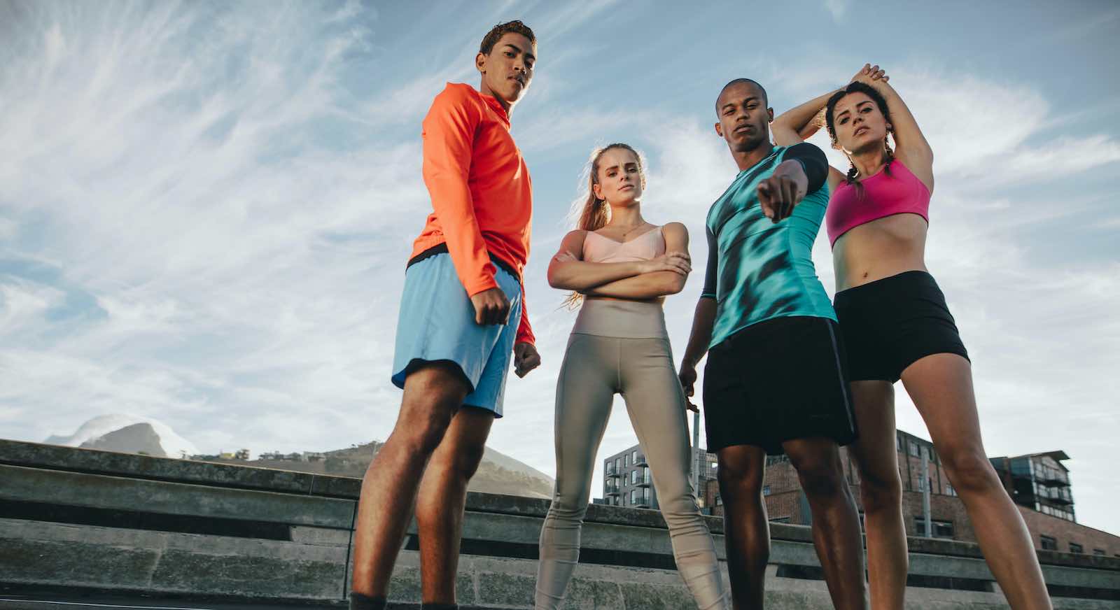 Athletes pointing to camera
