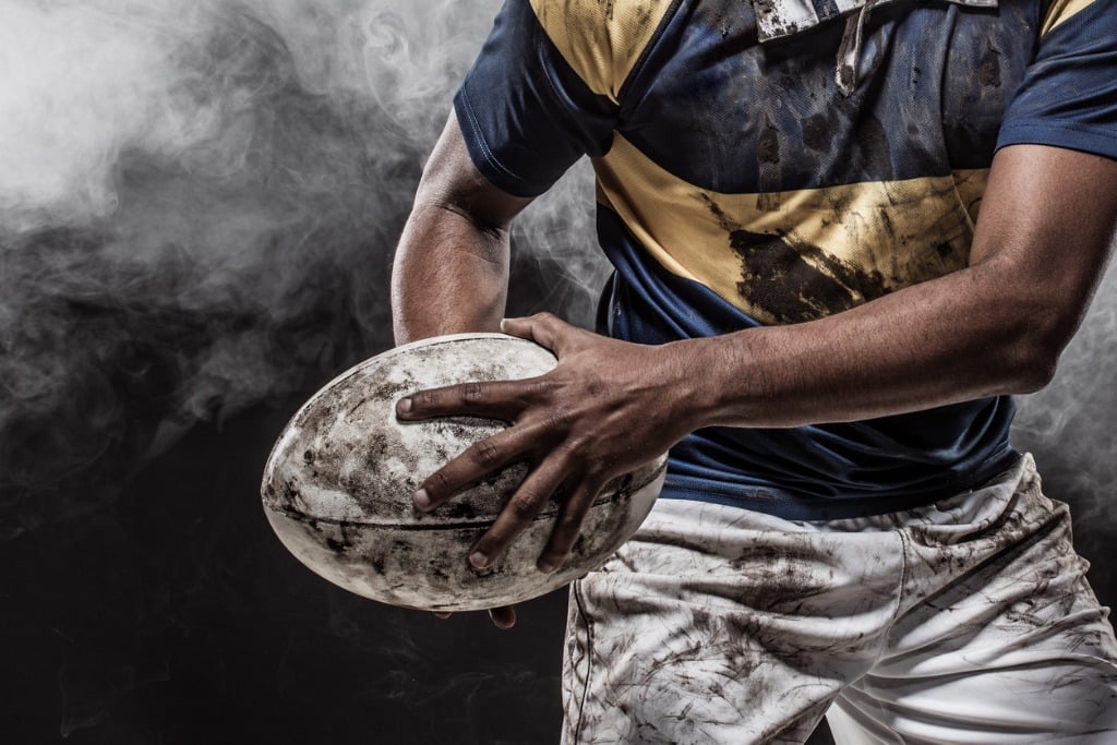 Muddy rugby player