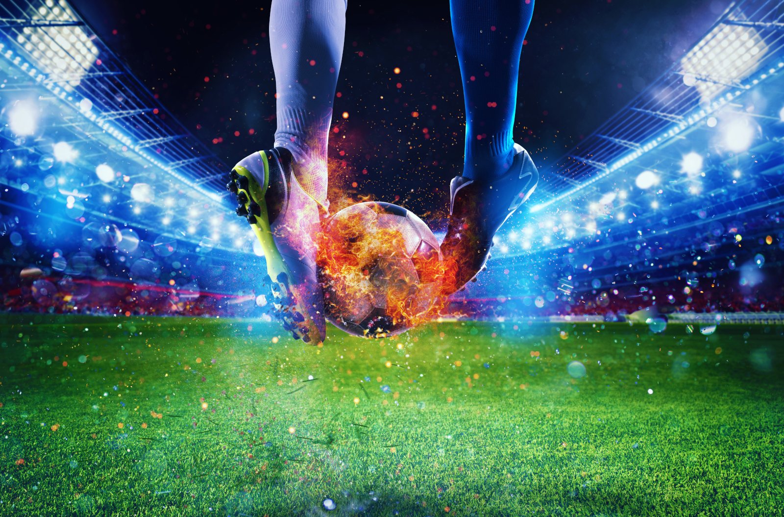 Football Players kicking flaming football