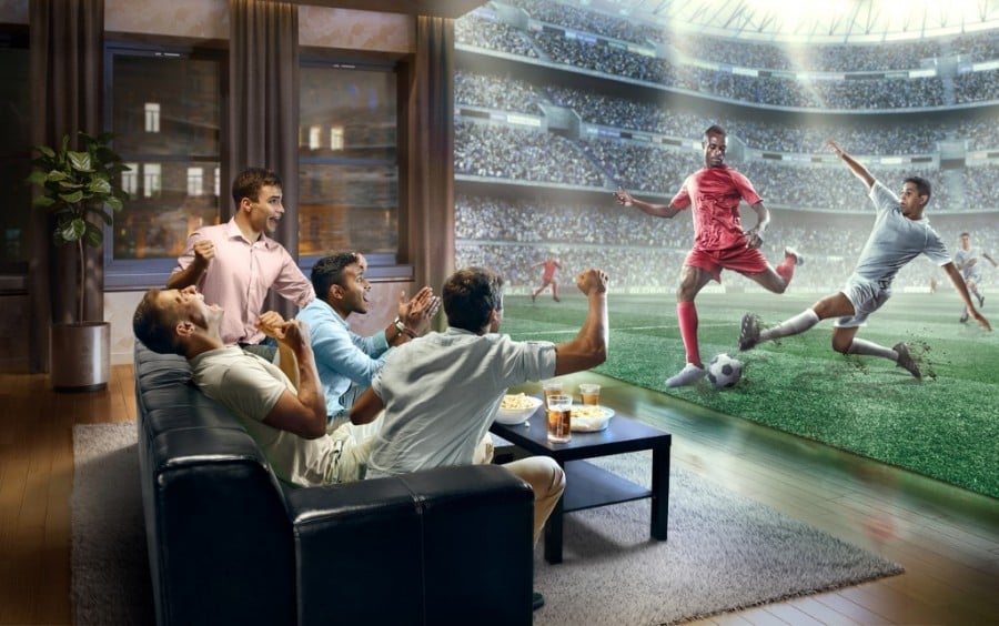 People Watching Realistic Football on TV People Watching Realistic Football on TV