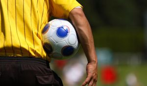 Referee Holding Football