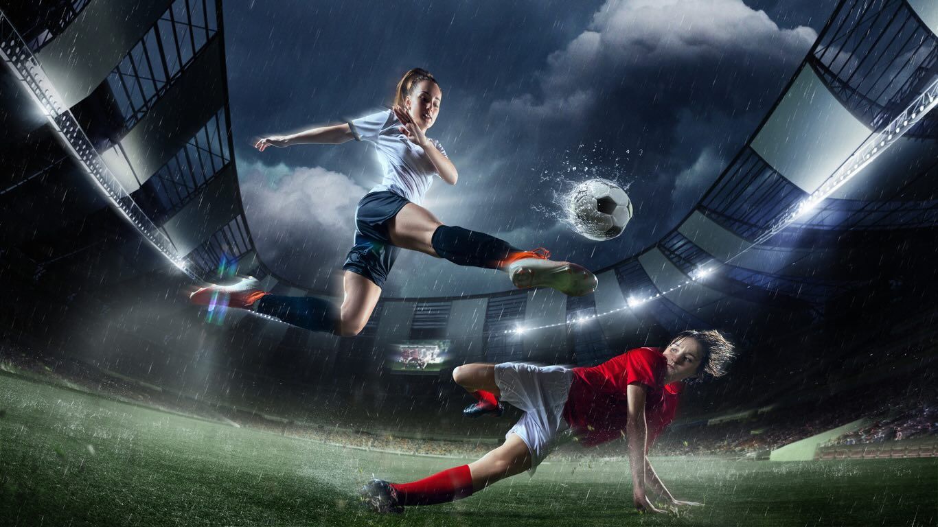 Female Footballer Tackling