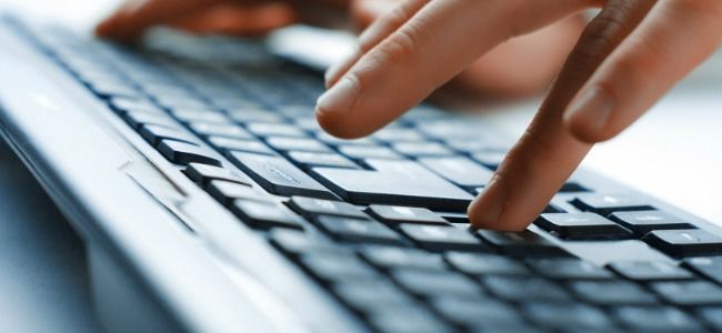 Hands typing on a keyboard