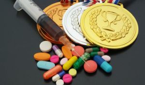 Doping in sport concept drugs medals and syringe