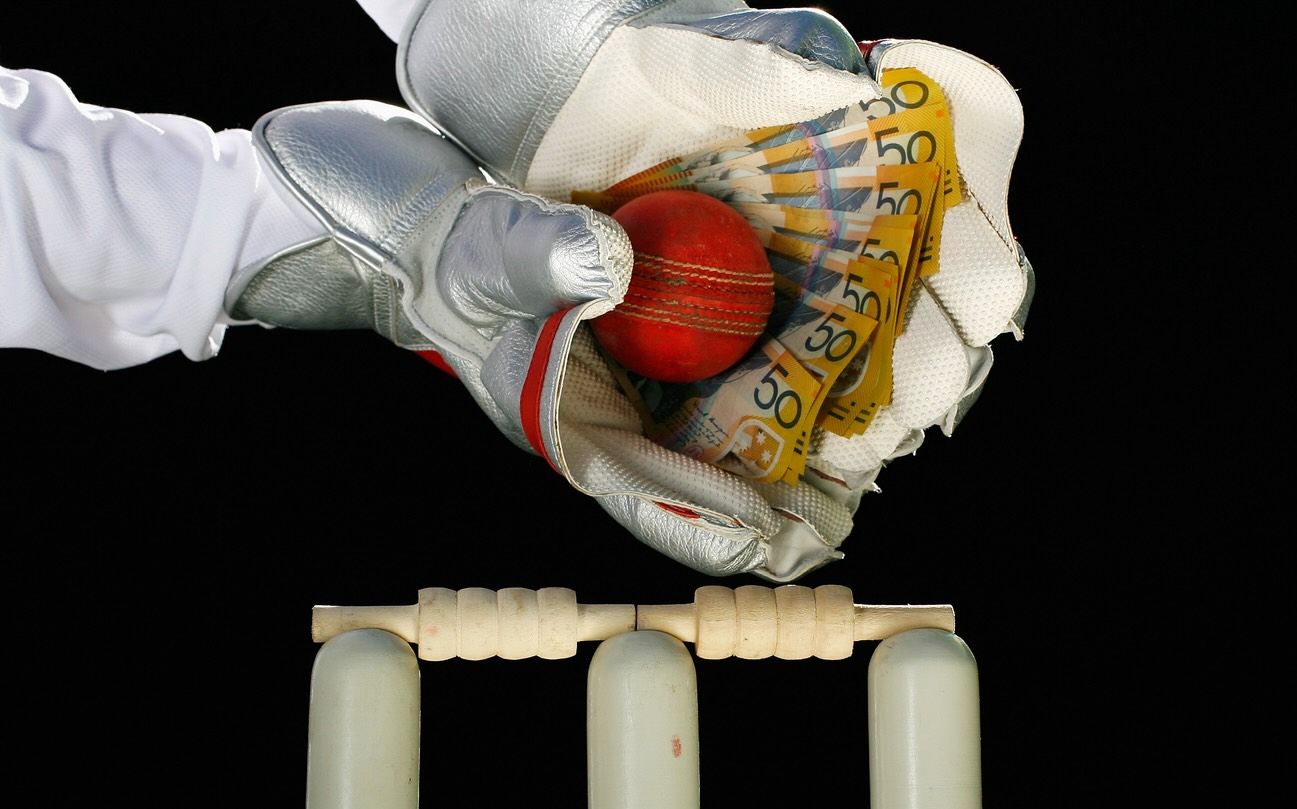 Wicketkeeper cash in gloves