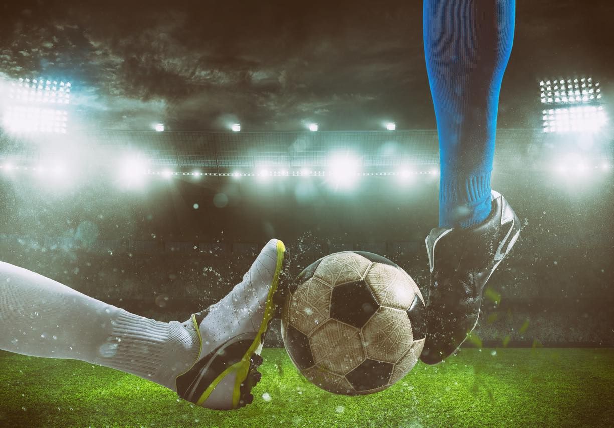 Footballers tackling