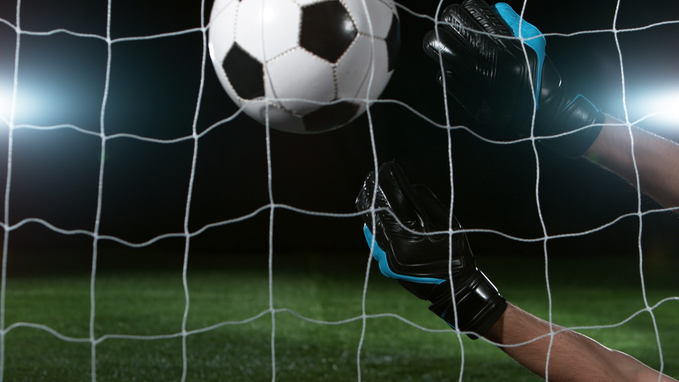 Goal keeper catching football