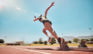 Woman Running On Track