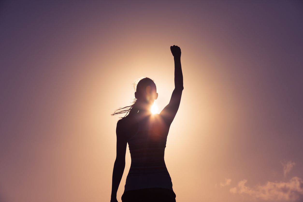 Female athlete winning pose