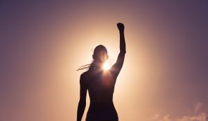 Female athlete winning pose