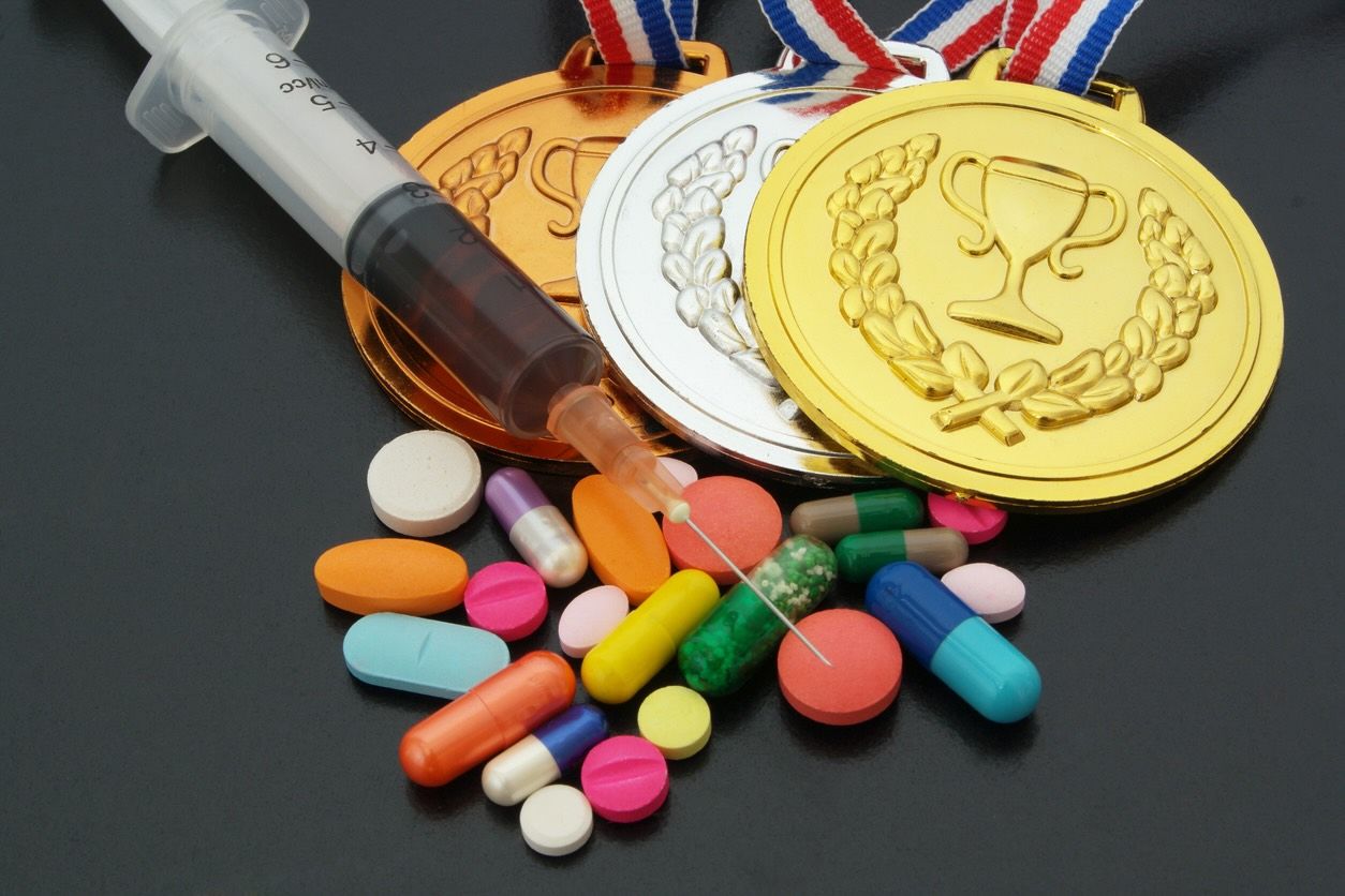Doping in sport concept drugs medals and syringe