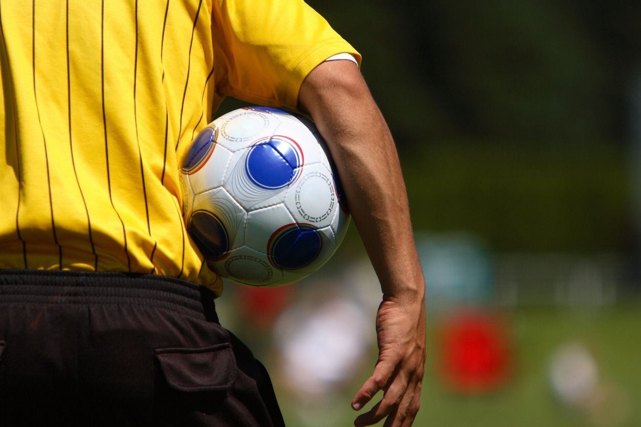 Referee Holding Football